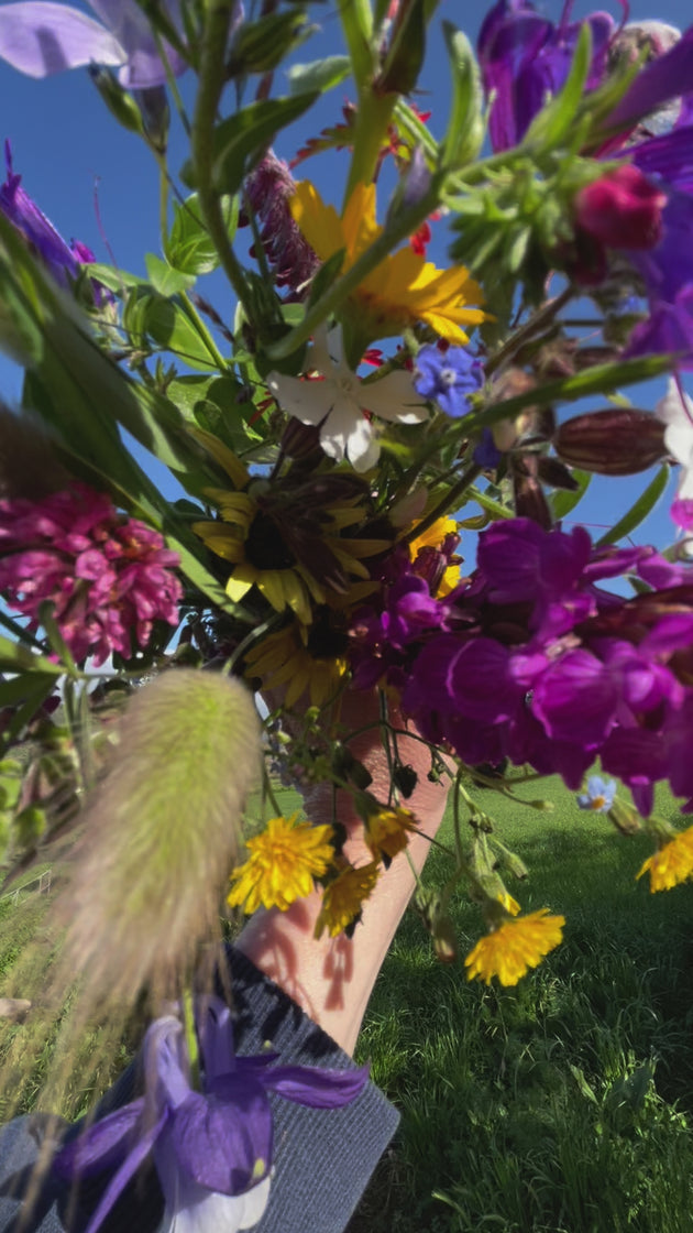 Wildflower bouquet held in hands